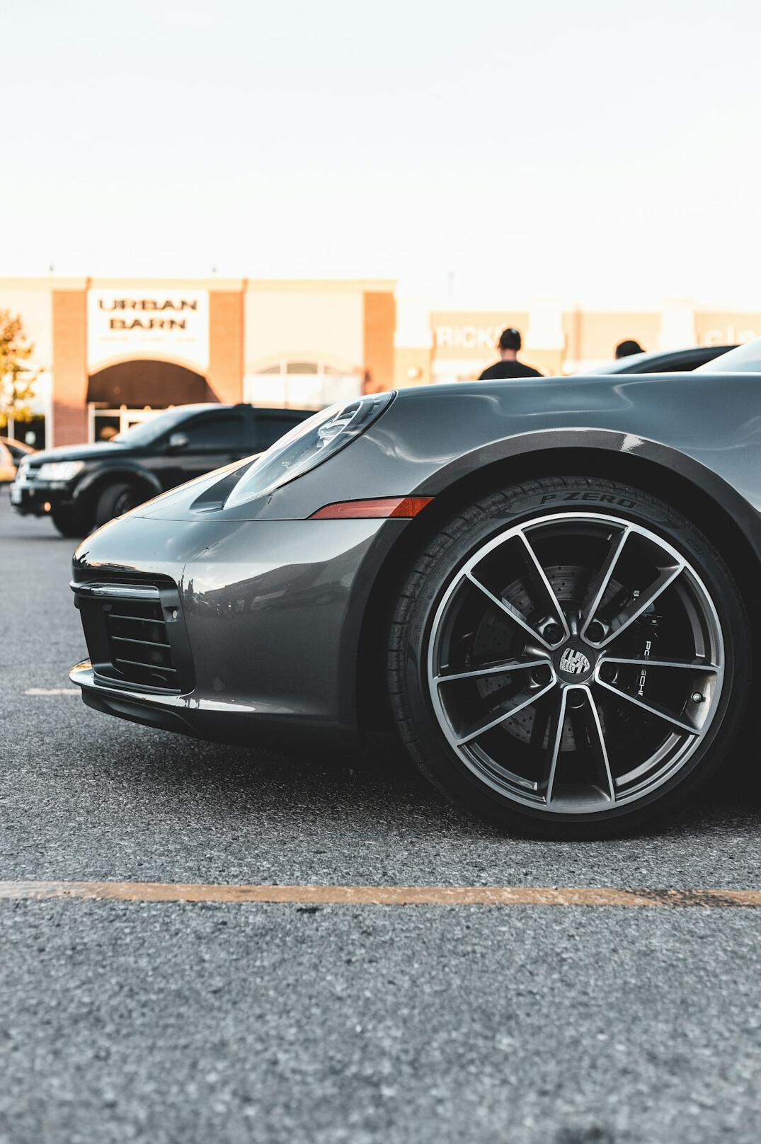 group of luxury cars parked